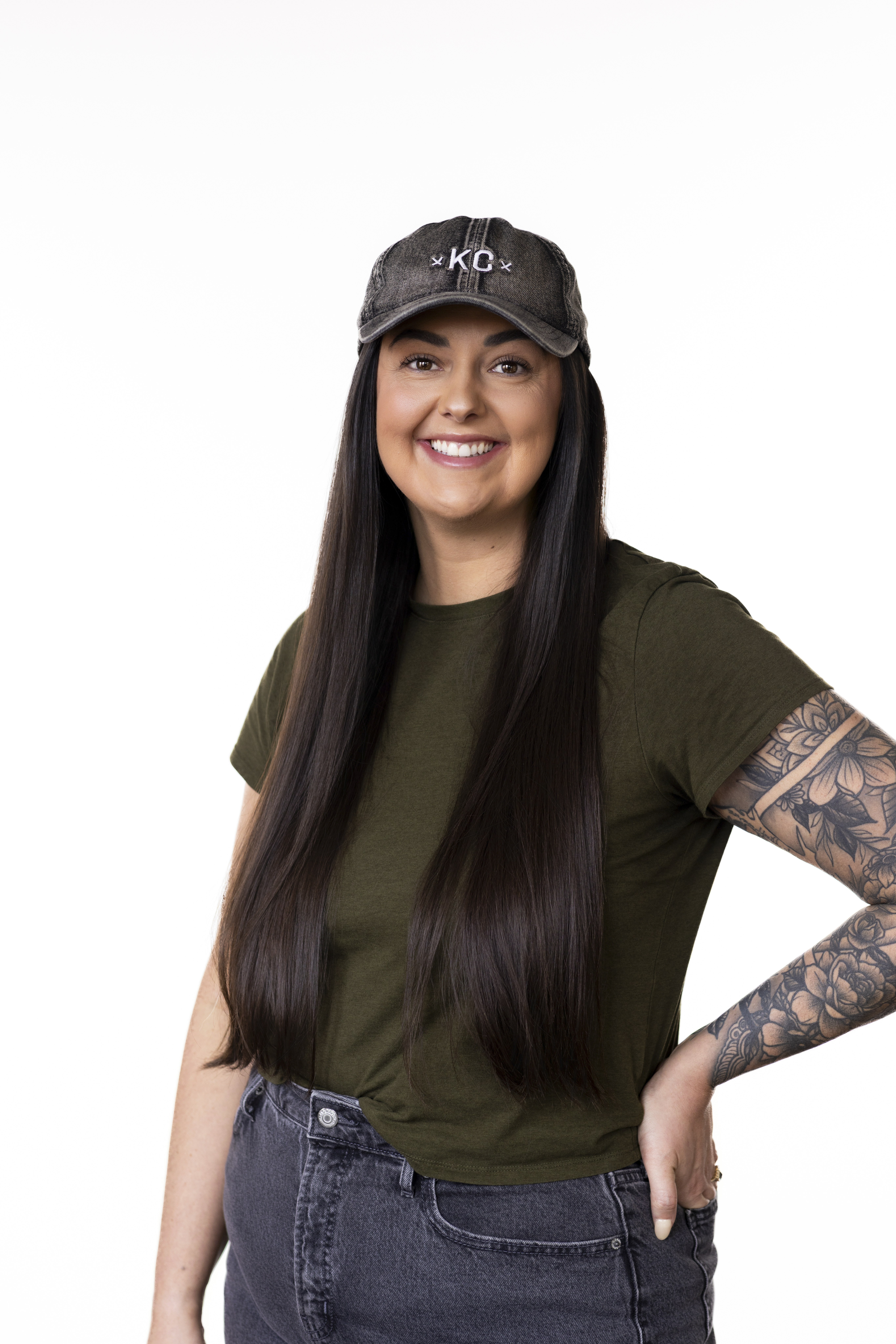 Portrait of a therapist wearing a 'Kansas City' ball cap and smiling